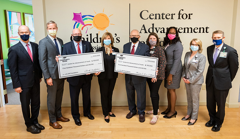 Celebrating the $1 million gift from Community Bank and Thomas W. Colbert Sr., senior chairman of the board, and his wife, Ann, to the Center for Advancement of Youth are, from left, Dr. Scott Rodgers, chair of psychiatry and human behavior; Dr. David Elkin, CAY executive director; Chuck Nicholson, Community Bank president and CEO; Dr. LouAnn Woodward, vice chancellor for health affairs; Thomas Colbert, Dr. Barbara Saunders, associate professor of child development; Veronnica McDuffey-Taylor, CAY director of operations; Karen Dowling, chief ambulatory/network operations officer; and Guy Giesecke, Children's of Mississippi CEO.